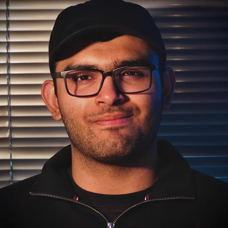 Portrait of Karan Paitka lit in blue and amber